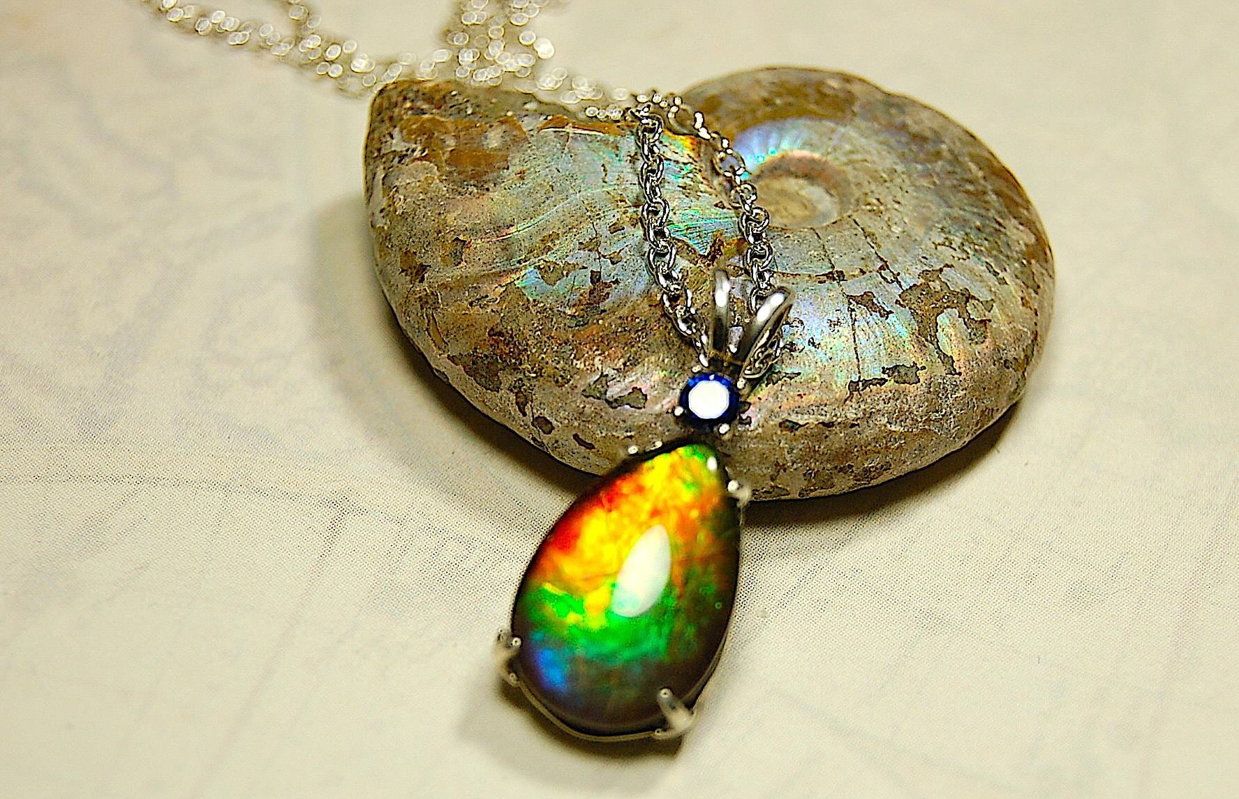 Sterling Silver set Ammolite Pendant with blue Sapphire.A gift idea for your wife she will treasure.Must see video.060916