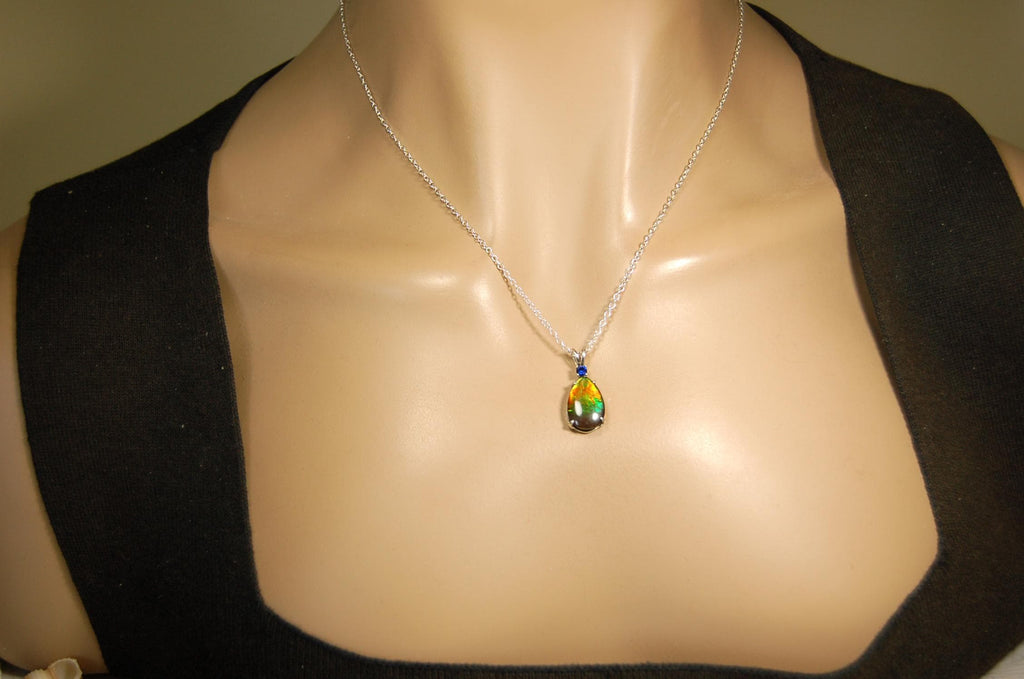 Sterling Silver set Ammolite Pendant with blue Sapphire.A gift idea for your wife she will treasure.Must see video.060916