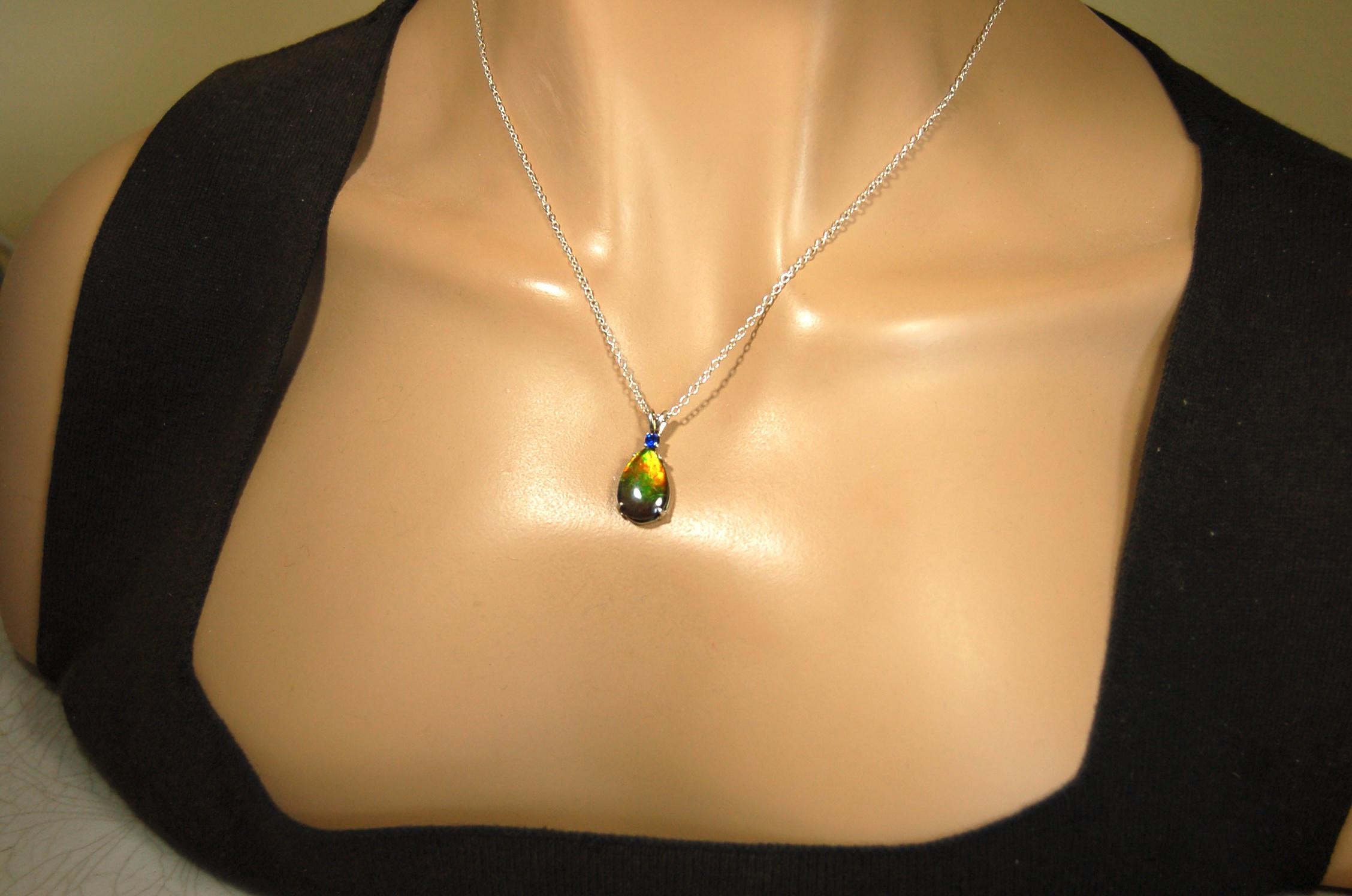 Sterling Silver set Ammolite Pendant with blue Sapphire.A gift idea for your wife she will treasure.Must see video.060916